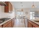 Gourmet kitchen featuring stainless appliances and barstool seating at 23038 E Twilight Dr, Queen Creek, AZ 85142