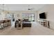 Bright living room boasting a large ceiling fan, comfortable seating, and sliding glass doors that lead to the yard at 23038 E Twilight Dr, Queen Creek, AZ 85142