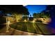 Backyard oasis with manicured lawn and soft lighting for elegant evenings and relaxing ambiance at 3109 E Cholla St, Phoenix, AZ 85028