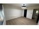 This bedroom has light wood floors, neutral walls, and a dark door creating a serene atmosphere at 3109 E Cholla St, Phoenix, AZ 85028