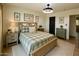 Cozy bedroom with a farmhouse-style bed, soft green accents, and warm, inviting decor at 3109 E Cholla St, Phoenix, AZ 85028