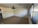Spacious bedroom with a large window and wood-look floors at 3109 E Cholla St, Phoenix, AZ 85028
