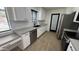Beautiful, updated kitchen with white cabinets, stainless steel appliances, and open layout, perfect for entertaining at 3109 E Cholla St, Phoenix, AZ 85028