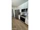 Modern kitchen featuring stainless steel appliances, bright white cabinetry, and durable hard surface countertops at 3109 E Cholla St, Phoenix, AZ 85028