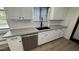 Close up of a modern kitchen sink featuring a large basin, stylish fixtures, and a subway tile backsplash at 3109 E Cholla St, Phoenix, AZ 85028