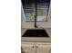 Close-up of a modern kitchen sink with a sleek black faucet and stylish design at 3109 E Cholla St, Phoenix, AZ 85028
