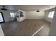 Open-concept living space features modern lighting, seamlessly connects to the kitchen with a stylish breakfast bar, creating an inviting atmosphere at 3109 E Cholla St, Phoenix, AZ 85028