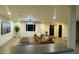 A spacious living room with modern furnishings, wood floors, and natural light, perfect for relaxation at 3109 E Cholla St, Phoenix, AZ 85028