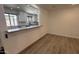 Inviting living room featuring a convenient breakfast bar, seamlessly connects to the kitchen, enhancing the home's open and airy design at 3109 E Cholla St, Phoenix, AZ 85028