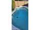 Overhead shot of a blue swimming pool featuring a unique shape and diving board at 3109 E Cholla St, Phoenix, AZ 85028