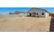 View of the spacious dirt backyard at 35816 W San Ildefanso Ave, Maricopa, AZ 85138