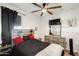 Bedroom with ceiling fan, an eye-catching headboard, and neutral tones at 35816 W San Ildefanso Ave, Maricopa, AZ 85138