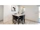 Bright dining area with a modern table and chairs near sliding door at 35816 W San Ildefanso Ave, Maricopa, AZ 85138