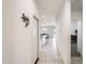 Hallway that leads into the kitchen. The view shows the open floorplan and natural lighting at 35816 W San Ildefanso Ave, Maricopa, AZ 85138