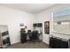 Office with a desk, rolling chair, filing cabinet, and an amazing Spiderman poster at 35816 W San Ildefanso Ave, Maricopa, AZ 85138