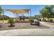 Community playground with climbing structure and covered picnic tables at 35816 W San Ildefanso Ave, Maricopa, AZ 85138