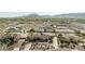 Desert home featuring desert landscaping, mature trees, and a circular drive at 3718 N Briere Ct, Buckeye, AZ 85396
