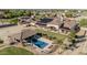Desert estate featuring pool, putting green, solar, and extensive desert landscaping at 3718 N Briere Ct, Buckeye, AZ 85396