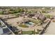 Desert estate featuring pool, putting green, solar, and extensive desert landscaping at 3718 N Briere Ct, Buckeye, AZ 85396
