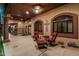 Charming back patio with ample seating and views of the landscaped backyard at 3718 N Briere Ct, Buckeye, AZ 85396