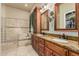 Well-appointed bathroom with double vanity with granite countertop and separate tub at 3718 N Briere Ct, Buckeye, AZ 85396
