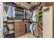 Walk-in closet with custom organizers providing ample storage space for clothing and accessories at 3718 N Briere Ct, Buckeye, AZ 85396