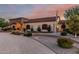Charming exterior showcasing manicured landscaping and an arched entrance, adding to the home's curb appeal at 3718 N Briere Ct, Buckeye, AZ 85396
