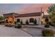 Well-maintained exterior featuring meticulous landscaping, an arched entrance, and a charming residential appeal at 3718 N Briere Ct, Buckeye, AZ 85396