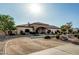 Impressive property with a grand entrance, landscaped front yard, and a spacious driveway for easy access at 3718 N Briere Ct, Buckeye, AZ 85396