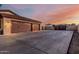 Spacious three car garage and extended driveway offer ample parking and storage at 3718 N Briere Ct, Buckeye, AZ 85396