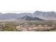 Scenic mountain view overlooking a residential area with lush greenery at 3718 N Briere Ct, Buckeye, AZ 85396