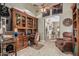 Office or den features custom wood built-ins and computer workstation area at 3718 N Briere Ct, Buckeye, AZ 85396