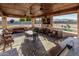 A spacious outdoor kitchen and living area offers a perfect setting for gatherings and relaxation at 3718 N Briere Ct, Buckeye, AZ 85396