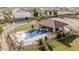 Backyard pool features a covered patio with outdoor seating and landscaping at 3718 N Briere Ct, Buckeye, AZ 85396