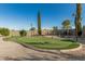Well maintained putting green featuring a sand trap in a private backyard at 3718 N Briere Ct, Buckeye, AZ 85396