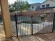 Backyard swimming pool with surrounding safety fence at 38242 N Armadillo Dr, San Tan Valley, AZ 85140