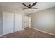 Bedroom with a ceiling fan and a closet for storage at 4001 E Apollo Rd, Phoenix, AZ 85042