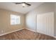 Bright bedroom with a closet and a window offering natural light at 4001 E Apollo Rd, Phoenix, AZ 85042