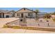 Quaint single-story home featuring desert landscaping, a mailbox with street numbers, and a brick-lined yard at 4001 E Apollo Rd, Phoenix, AZ 85042