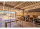 Open garage with metal shelving units, brick accents, and visible exterior access at 4001 E Apollo Rd, Phoenix, AZ 85042