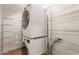 Laundry room featuring stacked washer and dryer, and wire shelving for storage at 4001 E Apollo Rd, Phoenix, AZ 85042