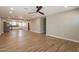 Spacious living area with tile flooring, a ceiling fan, recessed lighting, and open access to the kitchen at 4001 E Apollo Rd, Phoenix, AZ 85042