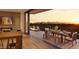 Beautiful balcony view with mountain backdrop, dining area, and lounge area with a fireplace at 4849 N Camelback Ridge Rd # B308, Scottsdale, AZ 85251