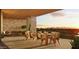 Relaxing covered balcony featuring outdoor dining and seating with stunning sunset and mountain views at 4849 N Camelback Ridge Rd # B308, Scottsdale, AZ 85251