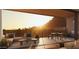 Inviting balcony featuring a full outdoor kitchen, dining area, and lounge seating with great views at 4849 N Camelback Ridge Rd # B308, Scottsdale, AZ 85251