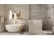 Modern bathroom featuring soaking tub, neutral tile, glass enclosed shower and upscale fixtures at 4849 N Camelback Ridge Rd # B308, Scottsdale, AZ 85251