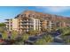 Luxury condo complex surrounded by mature landscaping with balconies and modern architecture at 4849 N Camelback Ridge Rd # B308, Scottsdale, AZ 85251