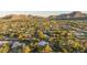 Aerial shot showcases the neighborhood with mature landscaping and mountain views at 4856 E Cheryl Dr, Paradise Valley, AZ 85253