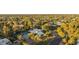 Expansive aerial view of lushly landscaped property with pool and neighboring homes at 4856 E Cheryl Dr, Paradise Valley, AZ 85253