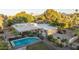 Aerial view of a desert home with a pool and covered parking with mountain and neighborhood views at 4856 E Cheryl Dr, Paradise Valley, AZ 85253